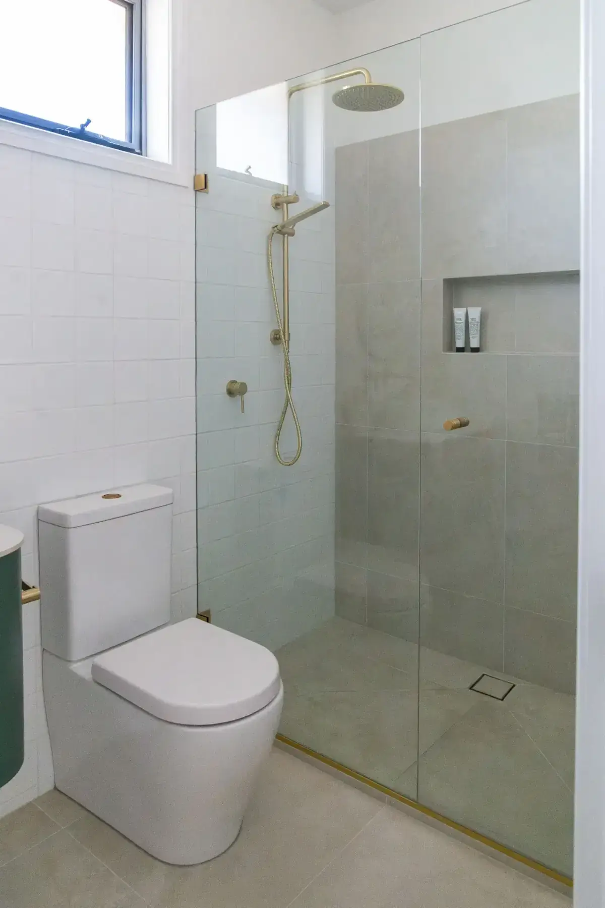 Toorak powder room with curved green vanity