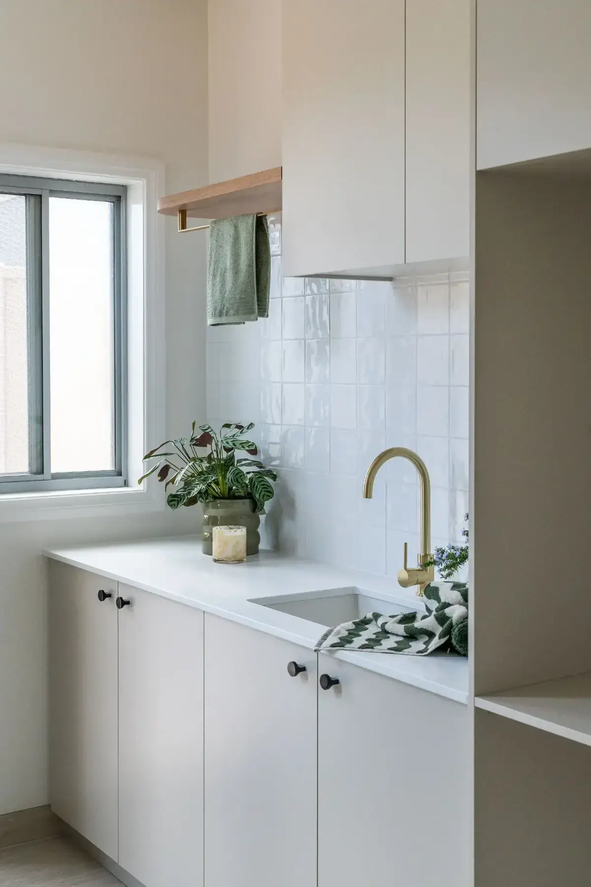 Hobsons Bay laundry with white square tile and brass