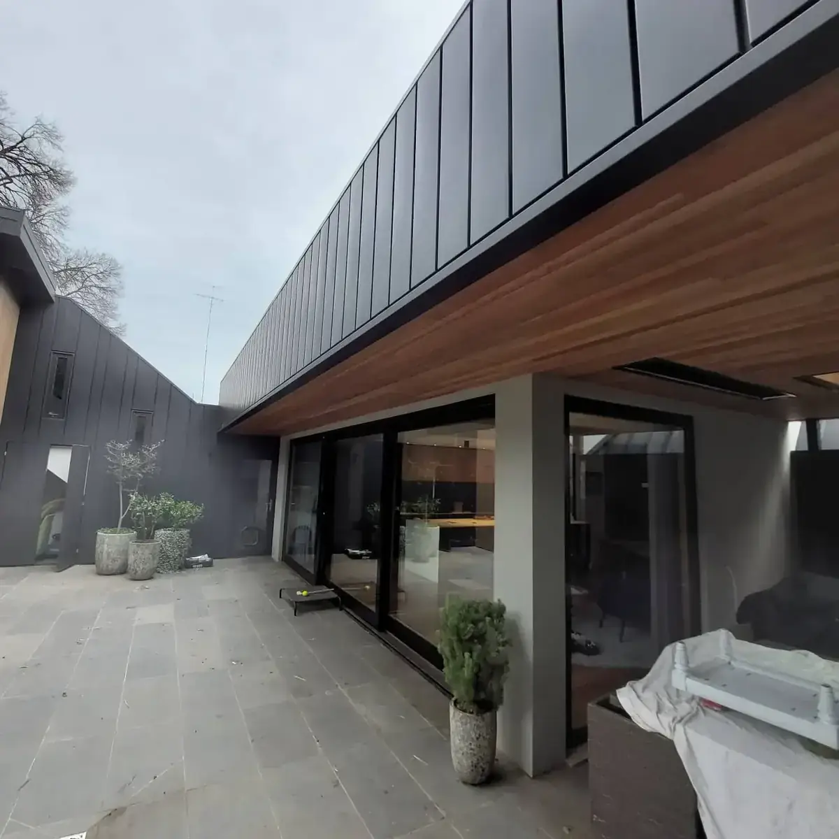 Rear home extension with zinc cladding and timber soffit — 2026 cost guide